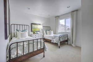 Carpeted bedroom with a mountain view