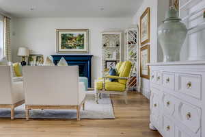 Sitting room with light hardwood / wood-style flooring