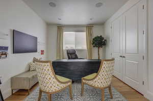 Dining space with hardwood / wood-style floors