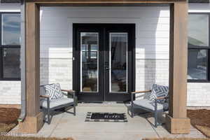 Entrance to property with french doors