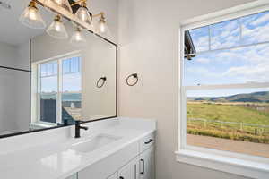 Bathroom with a mountain view and vanity