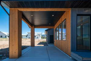 View of patio / terrace featuring a storage unit