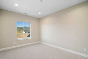 Empty room featuring carpet