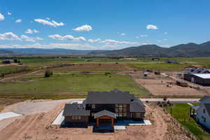 Birds eye view of property featuring a mountain view and a rural view