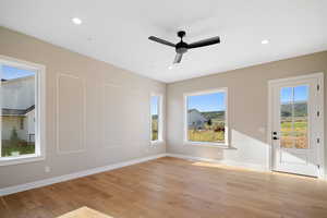 Spare room featuring light hardwood / wood-style floors and ceiling fan