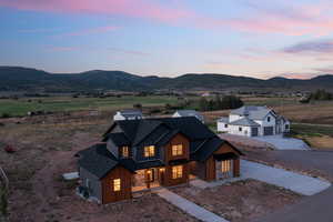 Modern farmhouse style home featuring a mountain view and central AC unit