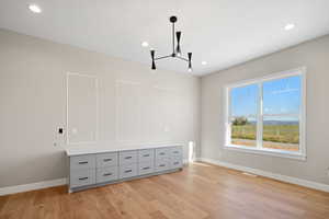 Spare room featuring light hardwood / wood-style flooring