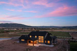 Exterior space with a mountain view, a rural view, and a patio