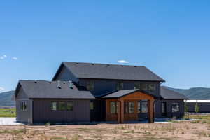 Back of house with a mountain view