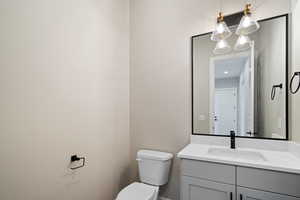 Bathroom featuring vanity and toilet