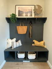 Mudroom with hardwood / wood-style flooring