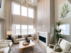 Family room with a towering ceiling and a wealth of natural light