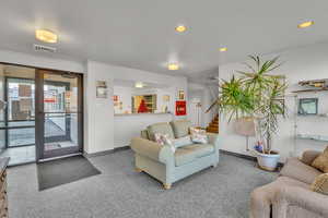 Living room featuring carpet floors