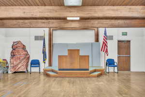 Interior space featuring beamed ceiling, hardwood / wood-style floors, and wooden ceiling