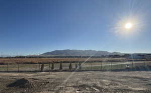 Property view of mountains with a rural view