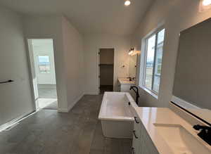 Bathroom with vanity and a bathtub