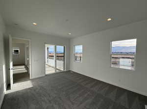 Carpeted empty room with a mountain view