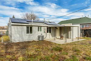 Rear view of property with a patio area and cooling unit