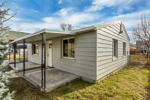 Exterior space featuring a front lawn