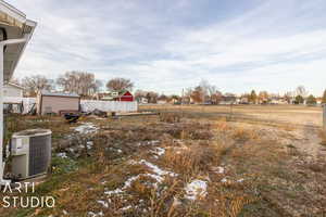 View of yard with central AC