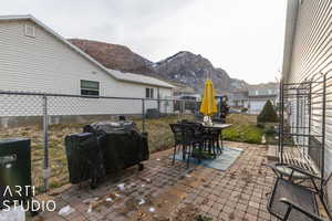 View of patio featuring a grill and a mountain view