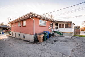 View of side of property with central AC