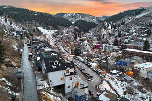 Snowy aerial view featuring a mountain view