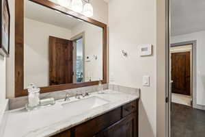 Bathroom featuring vanity and hardwood / wood-style flooring