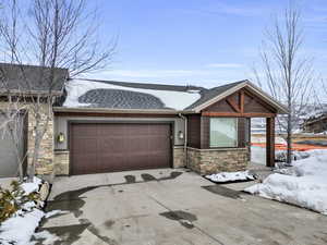 View of front facade featuring a garage