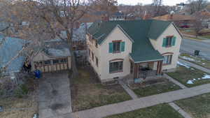 View of front of home featuring a porch and a garage