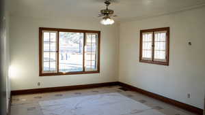 Living room featuring ceiling fan, crown molding, and hardwood floors