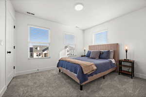 Bedroom with carpet flooring and a textured ceiling