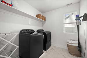 Laundry room with washer and dryer