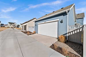 View of property exterior with a garage