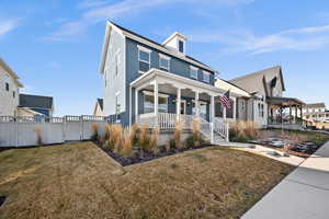 View of front of home featuring a porch and a front yard