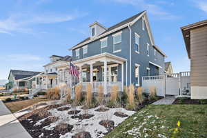 View of front facade featuring a porch and a front lawn