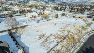 Snowy aerial view with a mountain view