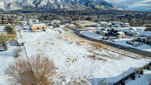 Snowy aerial view with a mountain view