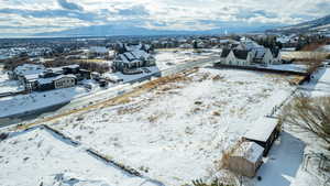 Snowy aerial view with a mountain view