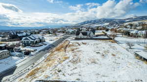 Snowy aerial view with a mountain view