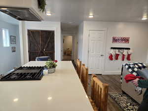 Dining area with LVP flooring and a textured ceiling