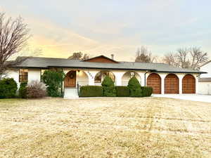 Ranch-style house featuring a garage