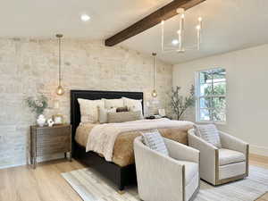 Bedroom with lofted ceiling with beams, wood-type flooring, a textured ceiling, and a notable chandelier