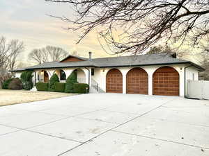 Ranch-style home featuring a garage