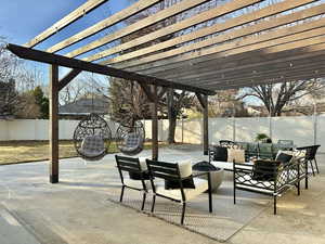 View of patio with a pergola and outdoor lounge area