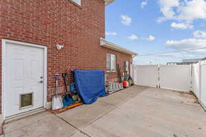 View of side of home featuring a patio