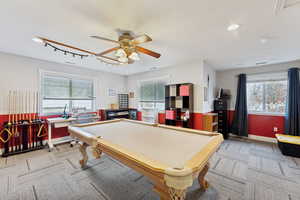 Rec room with a healthy amount of sunlight, light colored carpet, and billiards