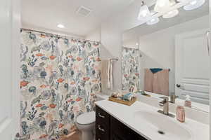 Bathroom with vanity and toilet