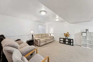 Living room with light colored carpet