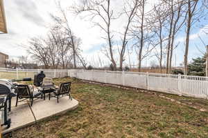 View of yard with a fire pit and a patio area